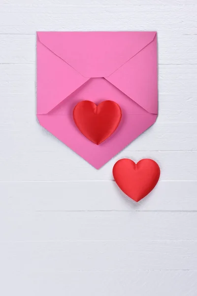 Valentines Day Concept Two Red Hearts Pink Envelope White Wood — Stock Photo, Image