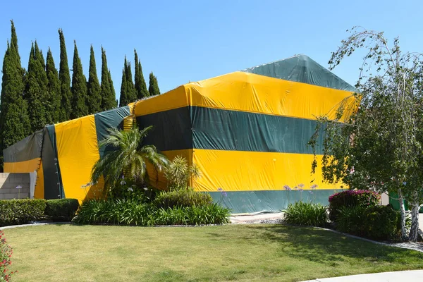 A two story house tented for Fumigation, a method of pest contro