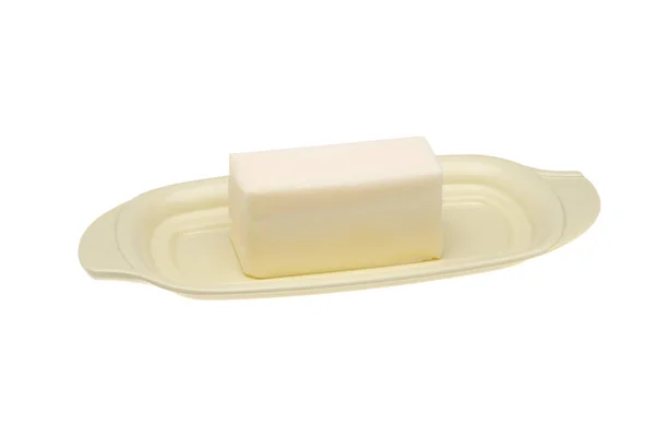 A stick of butter on a butter dish isolated on white — Stock Photo, Image