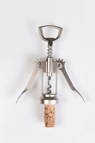 A wing style corkscrew and cork on white — Stock Photo, Image