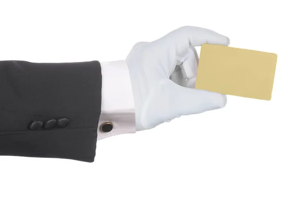 Formele gehandschoende hand met een blanco gouden creditcard of betaalpas ISO — Stockfoto