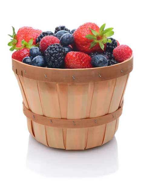 Assorted fresh picked berries in a basket over a white backgroun — Stock Photo, Image