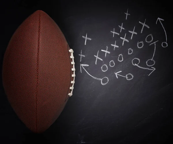 High angle flat lay of an American Pro Style Football and play d — Stock Photo, Image