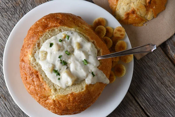 Overhead shot of a bread bowl of New England Style Clam Chowder — Stock Photo, Image