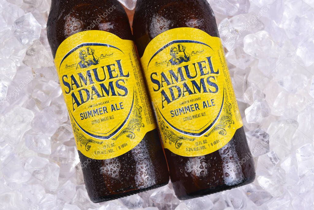 IRVINE, CALIFORNIA - 09 AUG 2020: Closeup of two bottes of Samuel Adams Summer Ale on a bed of ice.