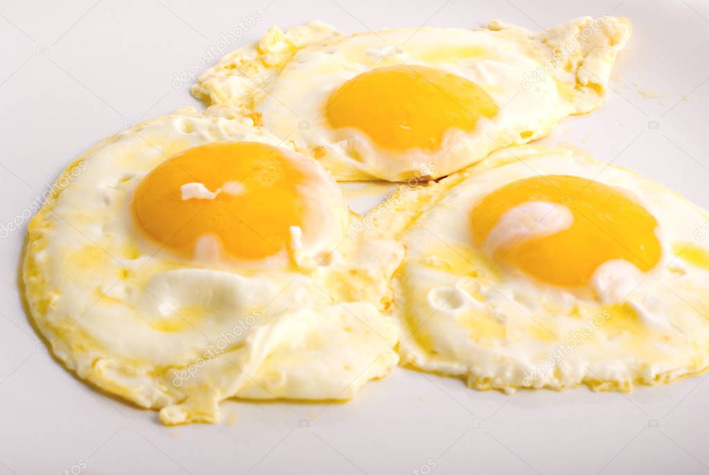 three fried eggs