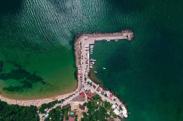 Aerial drone view of Black sea coast and yacht port. Summer holidays on the beach.