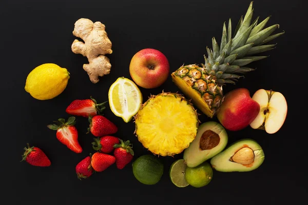 Fruits on black background. Healthy eating concept.