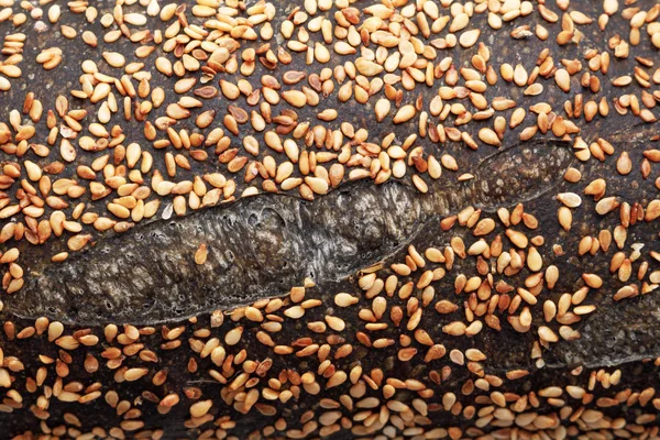 Zelfgemaakte zuurdesem hele brood stokbrood als textuur achtergrond — Stockfoto