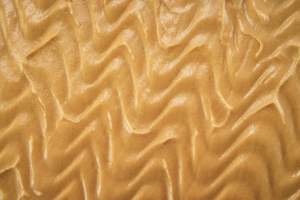 Textuur van taart met pinda's, walnoten, chocolade en karamel crème — Stockfoto