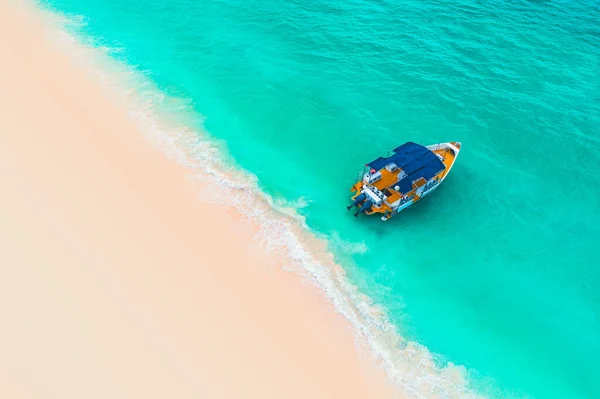 Beautiful carribean sea and boat , aerial view from the beach.