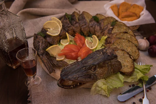 Stuffed pike with vegetables and greens. — Stock Image Stuffed pike with vegetables and greens. Stock Picture
