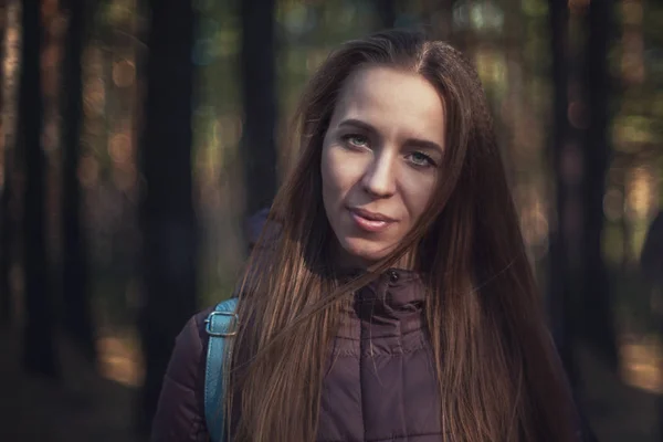 Pretty happy woman in forest