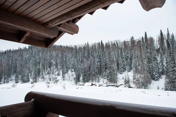 Winter holiday house in forest.