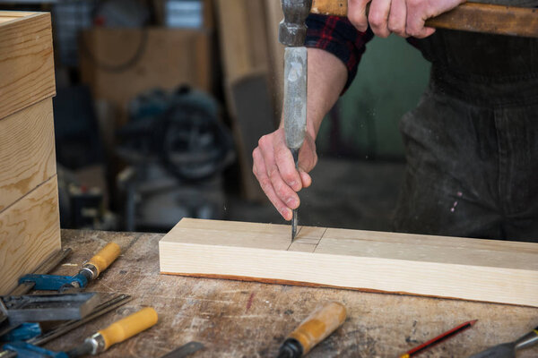 Carpenter working with a chisel