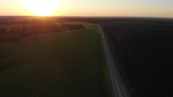 Aerial view of road in summer at sunset. — Stock Video