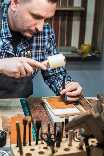 Concept of handmade craft production of leather goods.