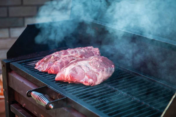 Pork meat steaks on the grill — Stock Photo, Image