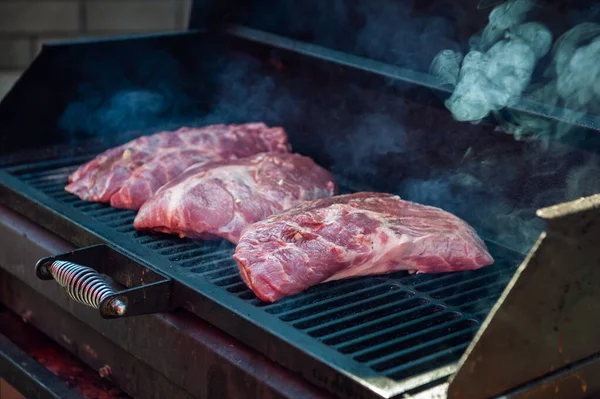 Pork meat steaks on the grill — Stock Photo, Image