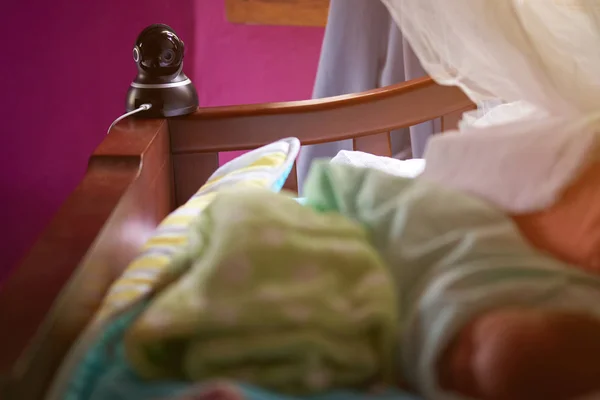 One dome camera in baby bed — Stock Photo, Image