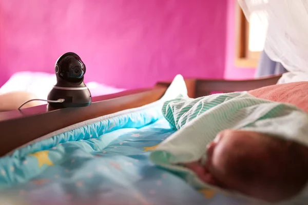Dome camera tracking sleeping baby — Stock Photo, Image