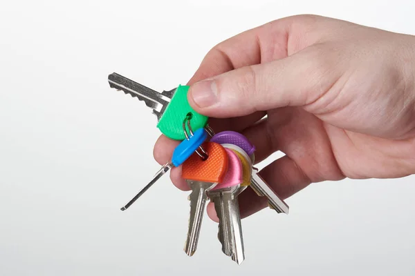 Sada barevných klíčů v ruce — Stock fotografie