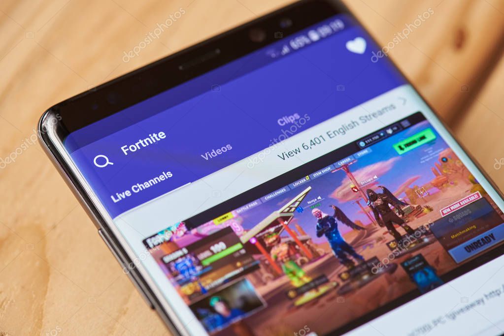 New york, USA - august 28, 2018: Fortnite game on twitch on smartphone screen background close up view