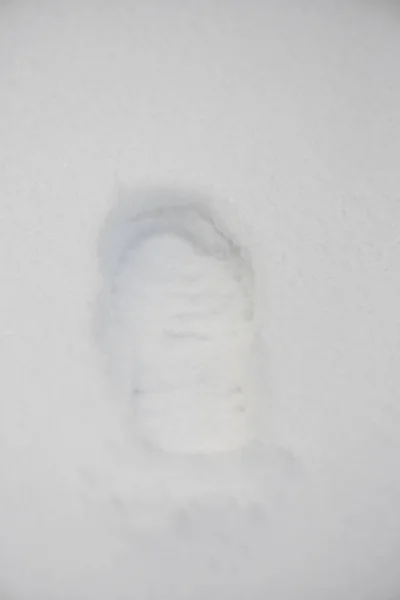 One footprint on snow background — Stock Photo, Image