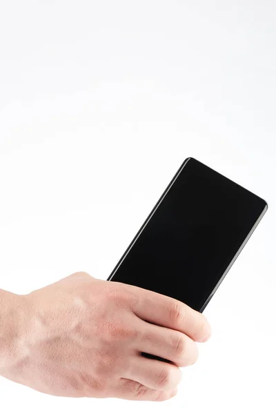 Primer plano de la espalda teléfono inteligente moderno en la mano — Foto de Stock