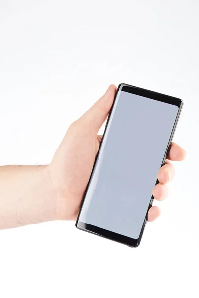Modern smartphone i hand — Stockfoto