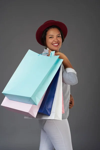 Latin woman with shopping bags