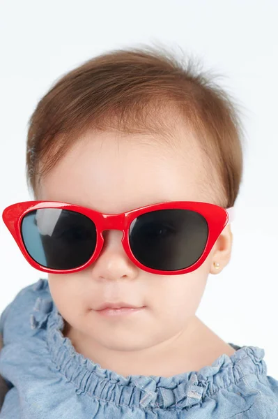 Cute little girl in sunglasses Stock Picture
