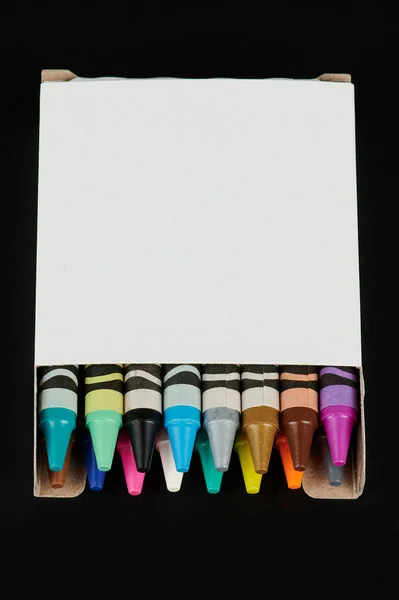 White box with colorfl crayons — 스톡 사진