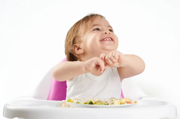 Portrait of baby playing with food — Stock Photo, Image