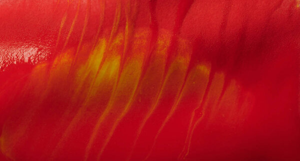 Smooth red paint abstract background close up view