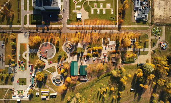 Amusement autumn park above top drone view. Colorful carnival park
