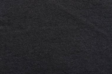 Siyah kumaş kumaş dokusu makro yakın görünüm. Koyu pamuğun yüzeyi