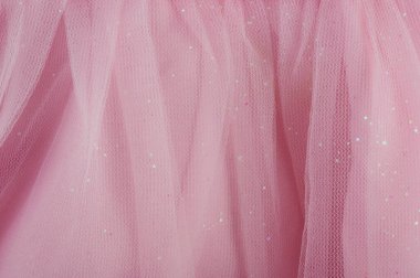 Pembe tül kumaş dokusu. Parlak, yakın görüşlü.