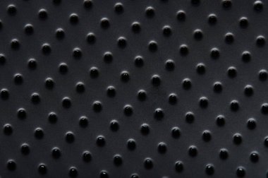 Noktaları yakın görünen siyah plastik yüzey