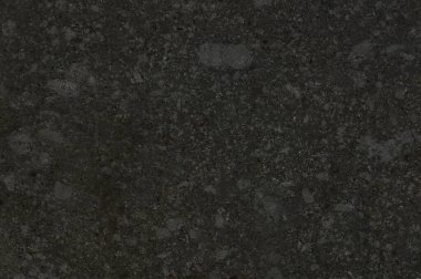 Metal tozu düz boş yüzeye fırçalanmış. Siyah taş arkaplan dokusu