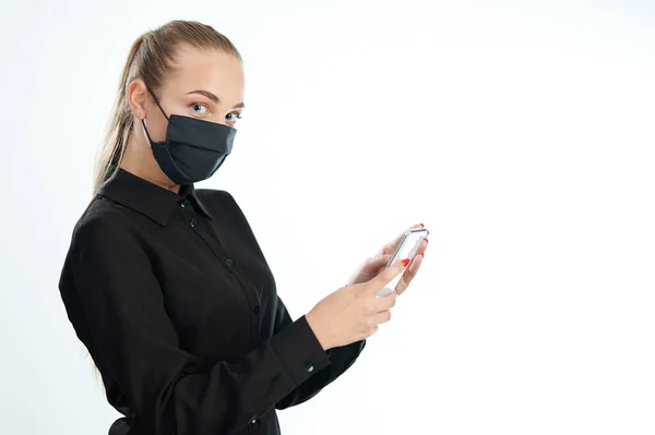 Young Woman Mask Using Smartphone Isolated White Studio Background — Stock Photo, Image