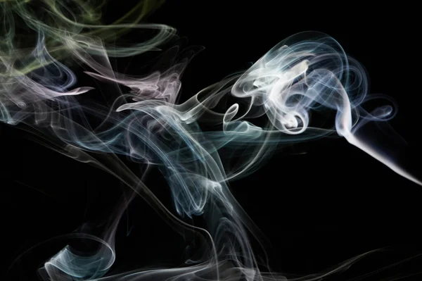 Abstract smoke swirls flow on black isolated background
