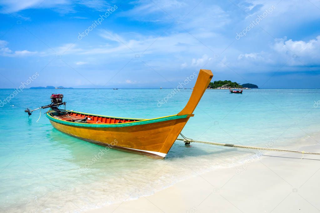 Traditional long tail boat on sunrise beach, Koh Lipe, Thailand