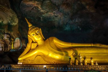Buddha in Wat Suwan Kuha temple, Thailand clipart