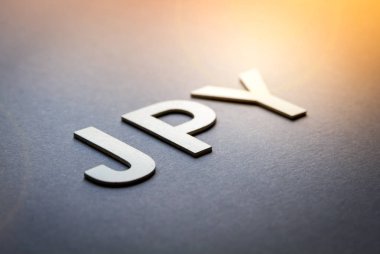 Jpy kelimesi beyaz harflerle yazılmış.