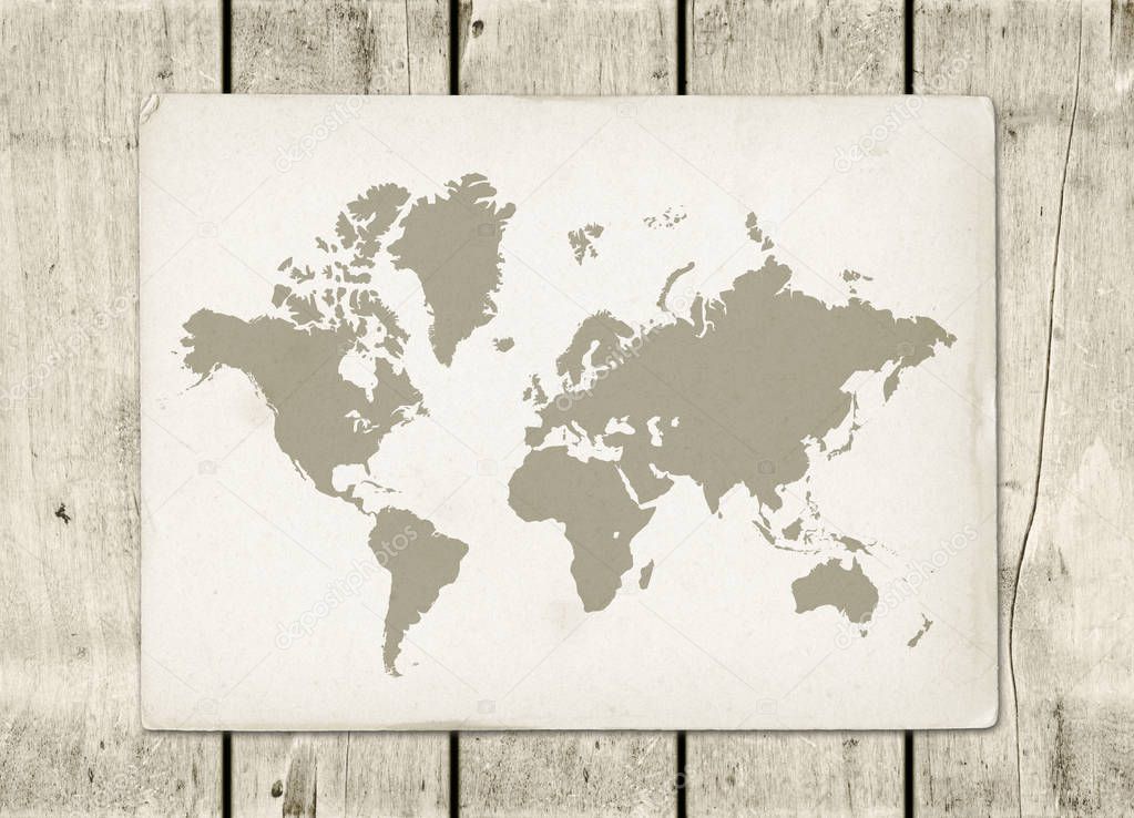 Vintage world map parchment on a wooden wall