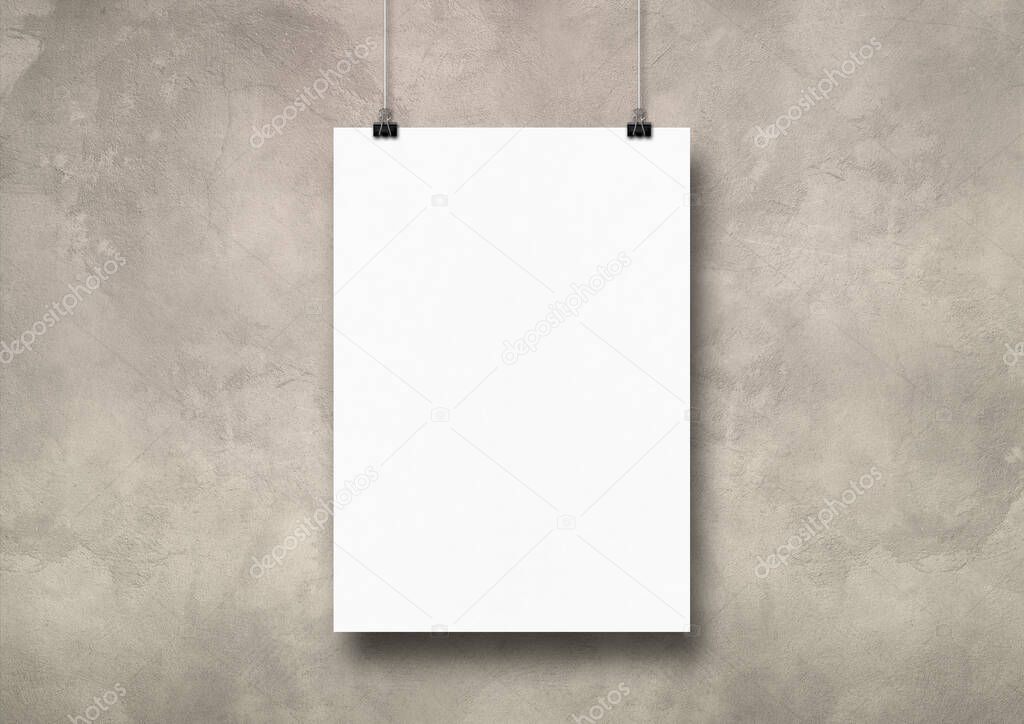 White poster hanging on a light concrete wall with clips. Blank mockup template