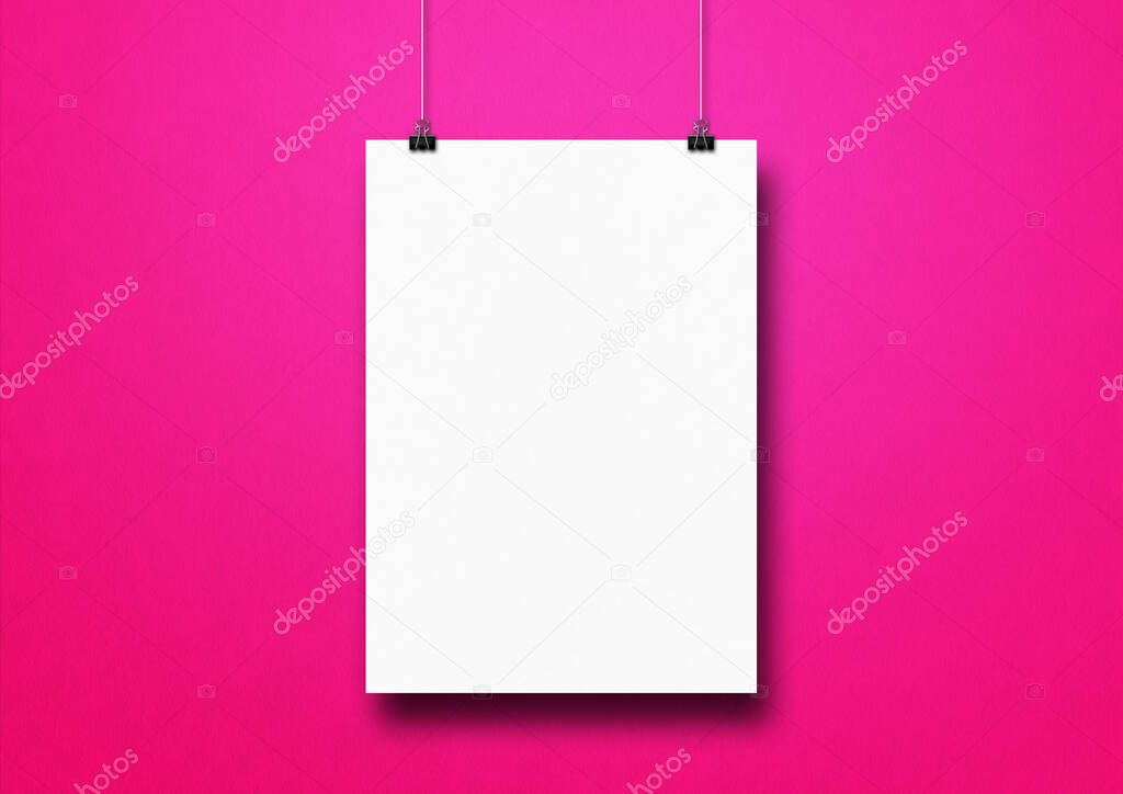 White poster hanging on a pink wall with clips. Blank mockup template