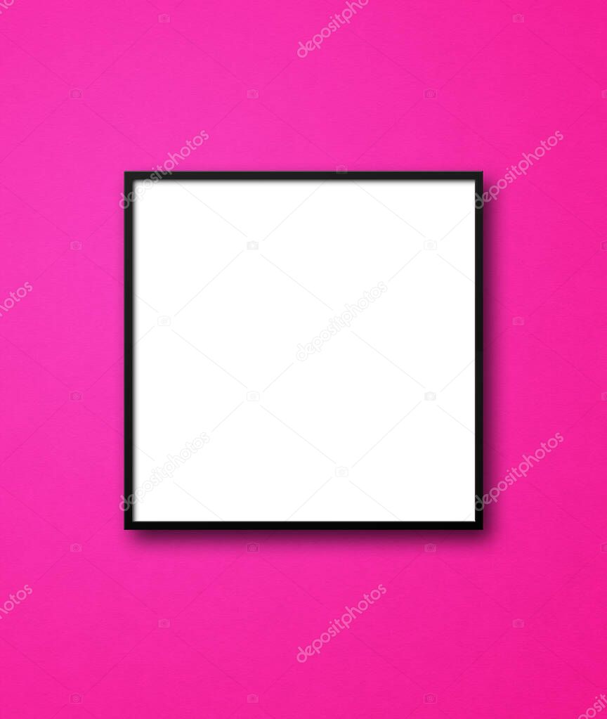 Black square picture frame hanging on a pink wall. Blank mockup template