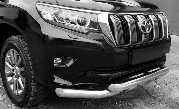 BIYSK, RUSSIA - MAY 16, 2020: Toyota Land Cruiser Prado, 2017. Car parked in a parking space. Black and white photography. 